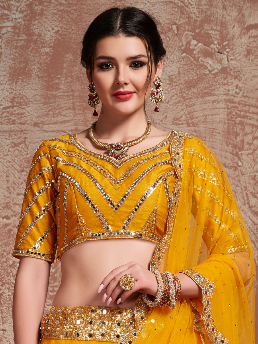 Amber Yellow Soft Net Embroidered Party Lehenga Choli