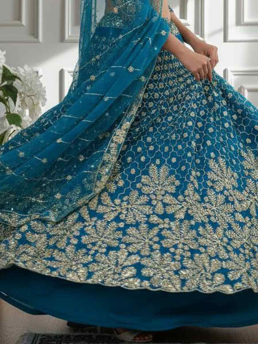Blue Butterfly Net Embroidered Bridal Wedding Reception Festival Heavy Border Lehenga Choli