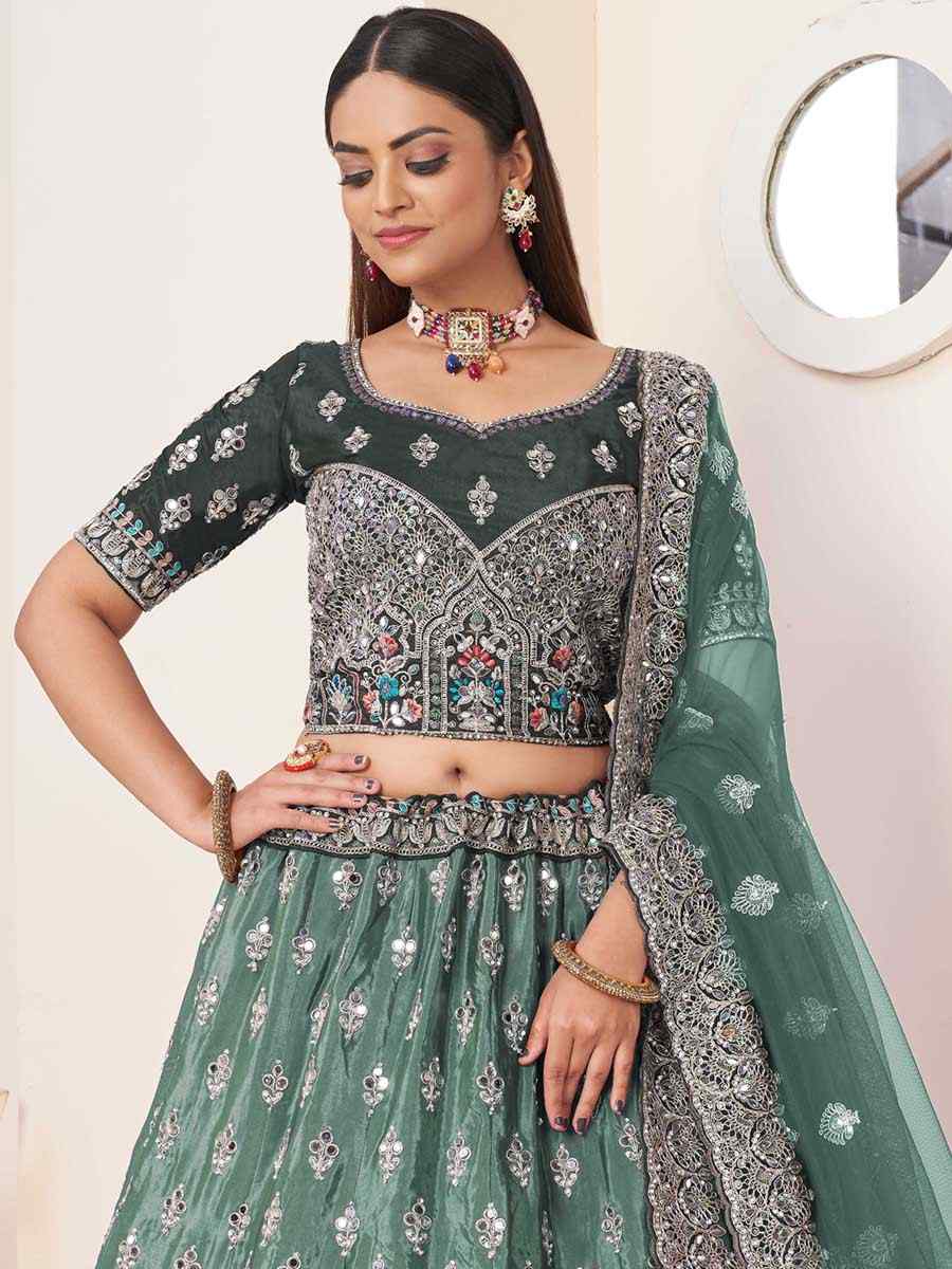 Green Net Embroidered Reception Wedding Heavy Border Lehenga Choli