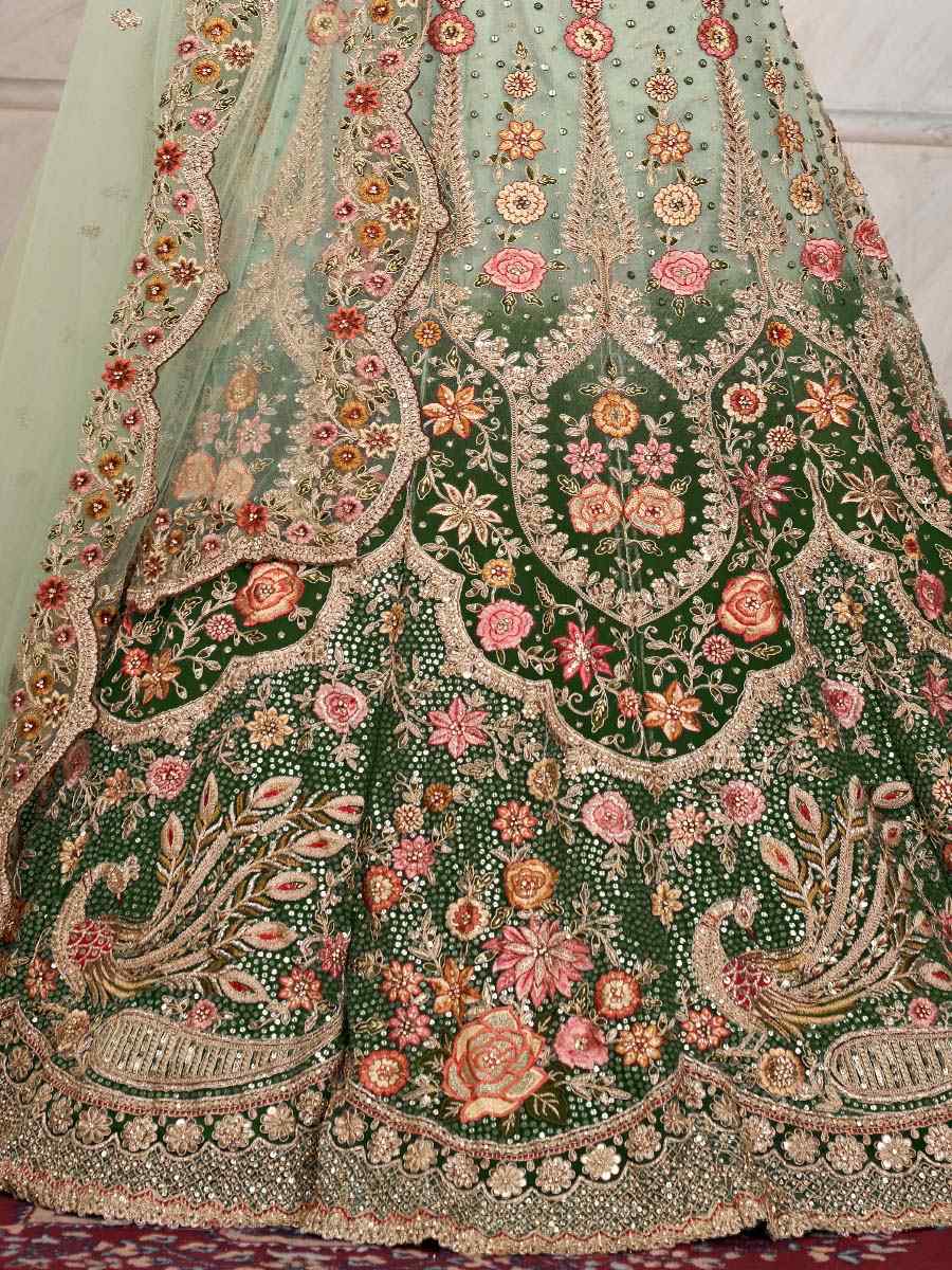 Green Soft Net Embroidered Bridal Reception Heavy Border Lehenga Choli