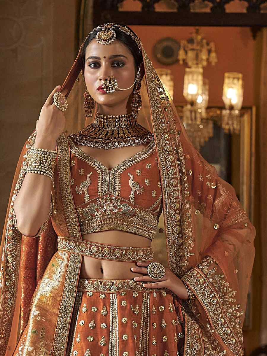 Light Orange Silk Embroidered Bridal Wedding Reception Festival Heavy Border Lehenga Choli