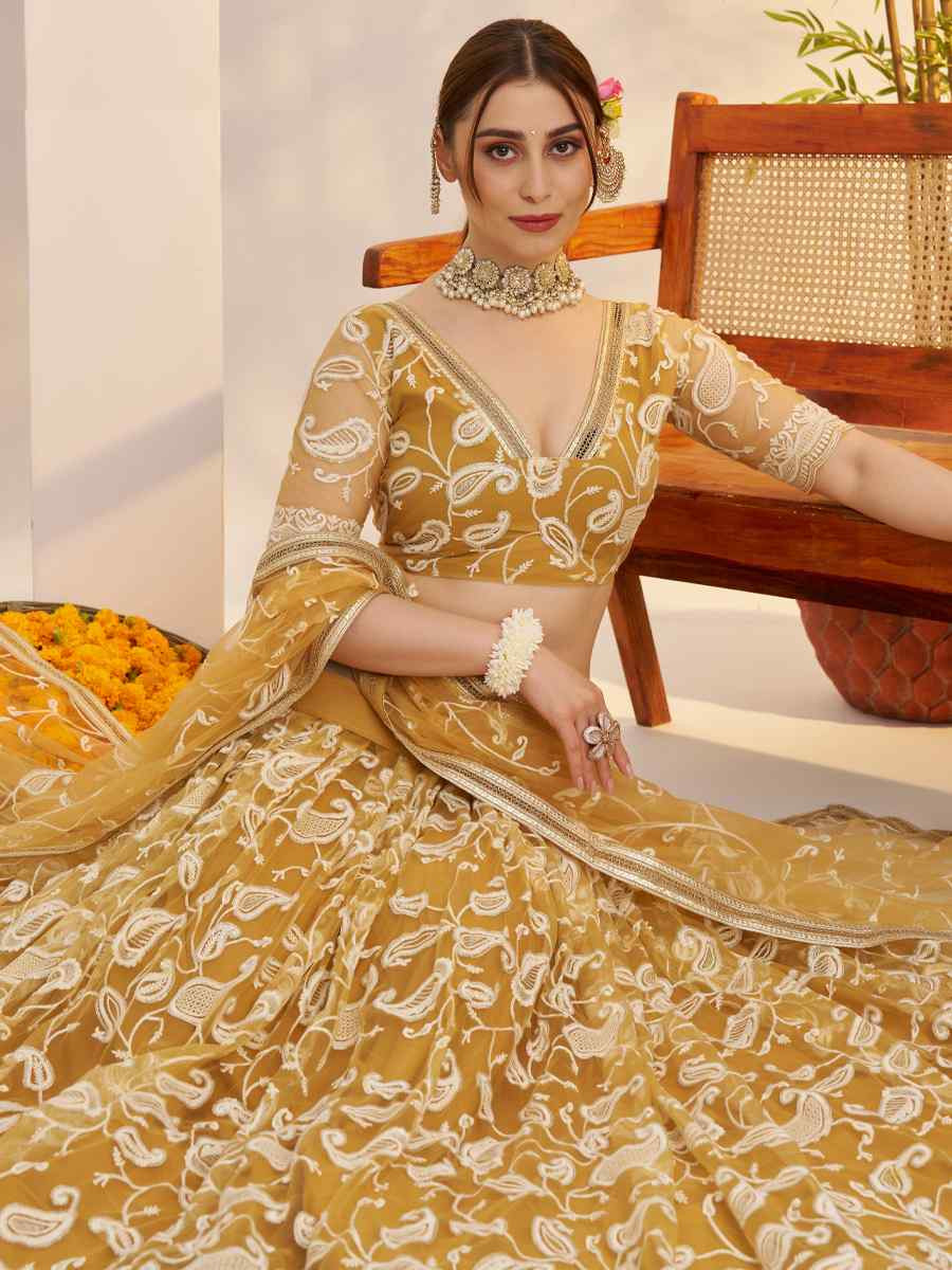 Mustard Butterfly Net Embroidered Bridal Wedding Reception Festival Heavy Border Lehenga Choli