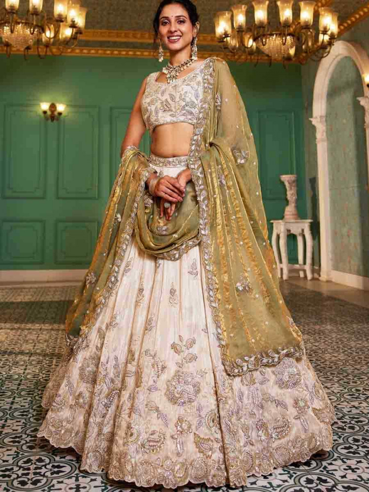 Image of Off White Tissue Embroidery Reception Party Wear Heavy Border Lehenga Choli