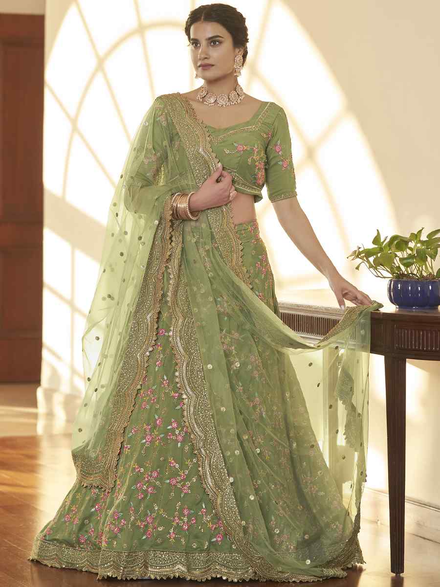 Pista Chinon Silk Embroidered Festival Party Wear Heavy Border Lehenga Choli