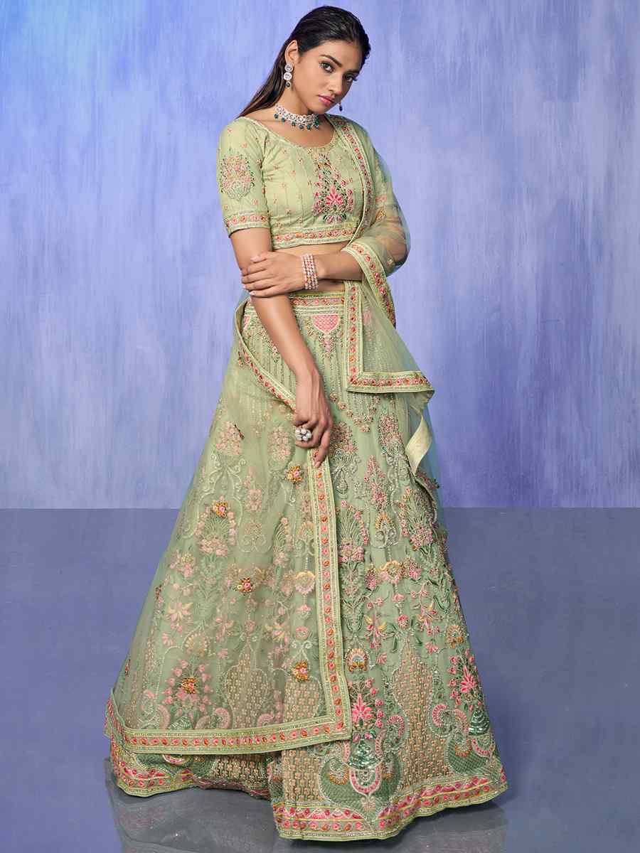 Pista Net Embroidered Bridal Reception Heavy Border Lehenga Choli