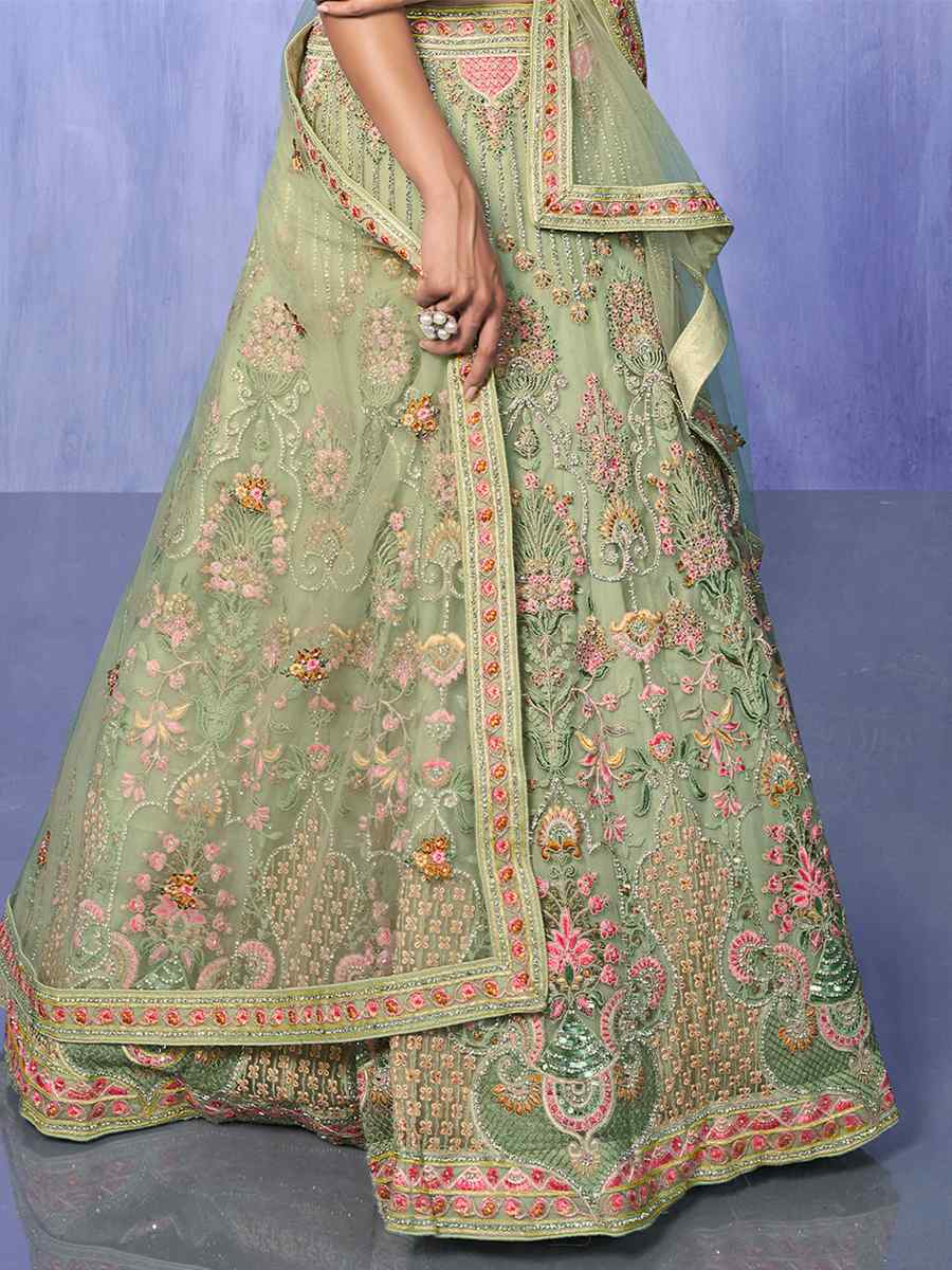 Pista Net Embroidered Bridal Reception Heavy Border Lehenga Choli