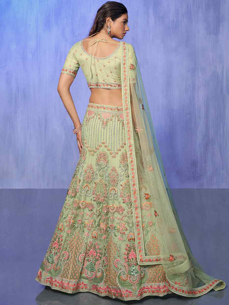 Pista Net Embroidered Bridal Reception Heavy Border Lehenga Choli