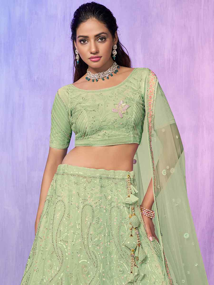 Pista Net Embroidered Bridal Reception Heavy Border Lehenga Choli