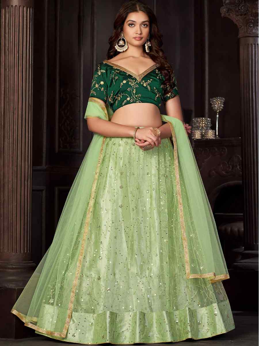 Pista Net Embroidered Reception Wedding Heavy Border Lehenga Choli