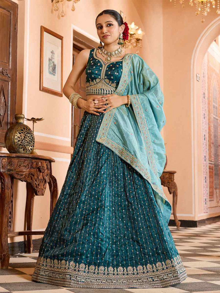 Image of Teal Tissue Silk Embroidered Wedding Reception Festival Heavy Border Lehenga Choli
