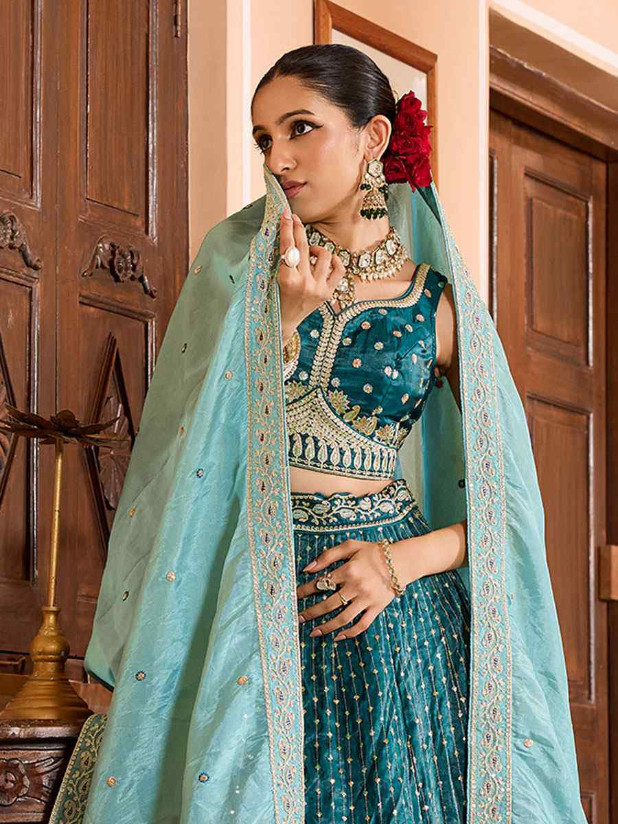 Teal Tissue Silk Embroidered Wedding Reception Festival Heavy Border Lehenga Choli
