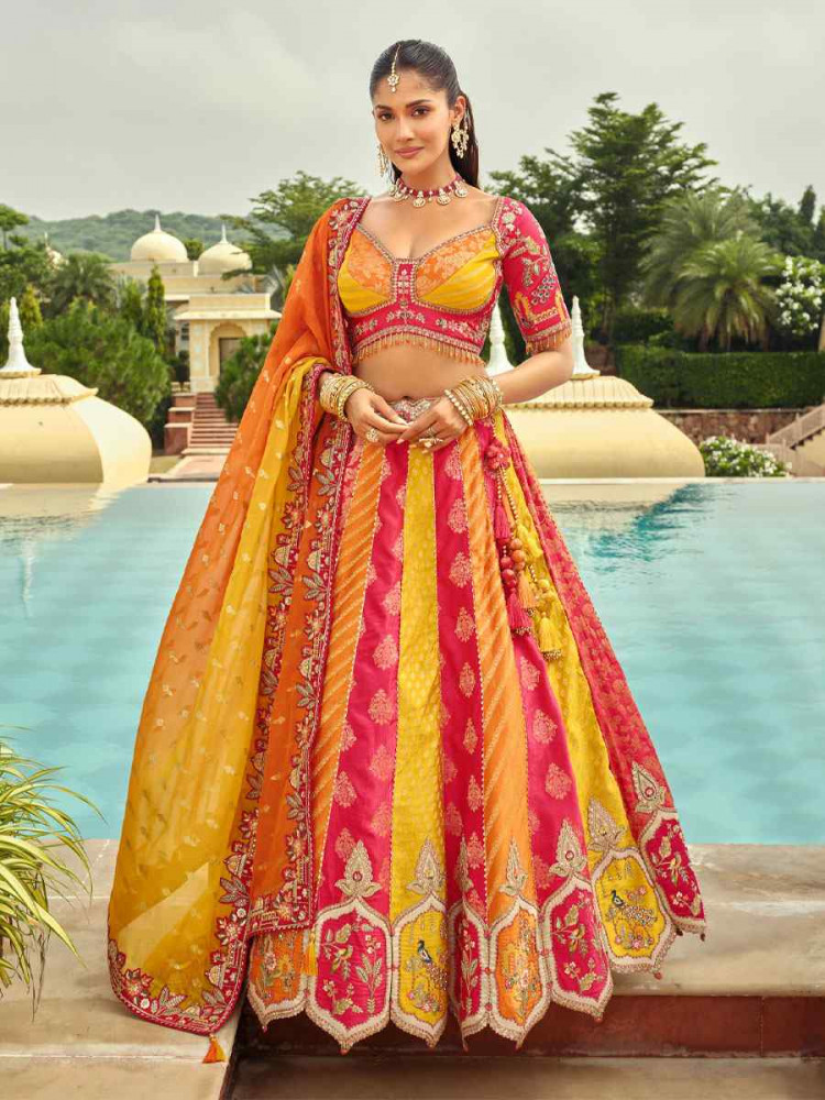Image of Yellow And Pink Heavy Pure Silk Embroidered Wedding Reception Festival Heavy Border Lehenga Choli