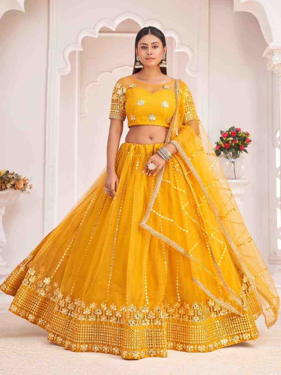 Yellow Butterfly Net Embroidered Party Wear Haldi Heavy Border Lehenga Choli