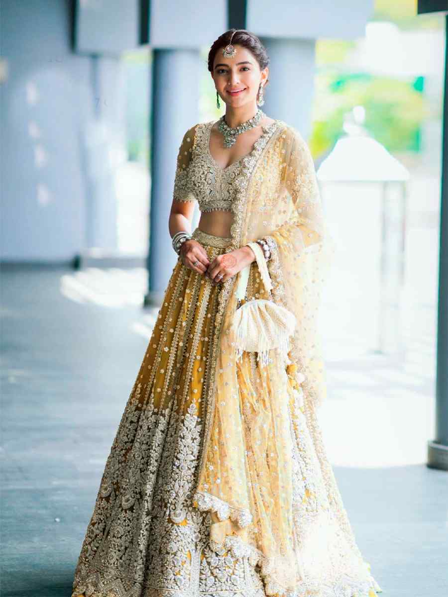 Yellow Heavy Butterfly Net Sequins Embroidered Reception Heavy Border Lehenga Choli